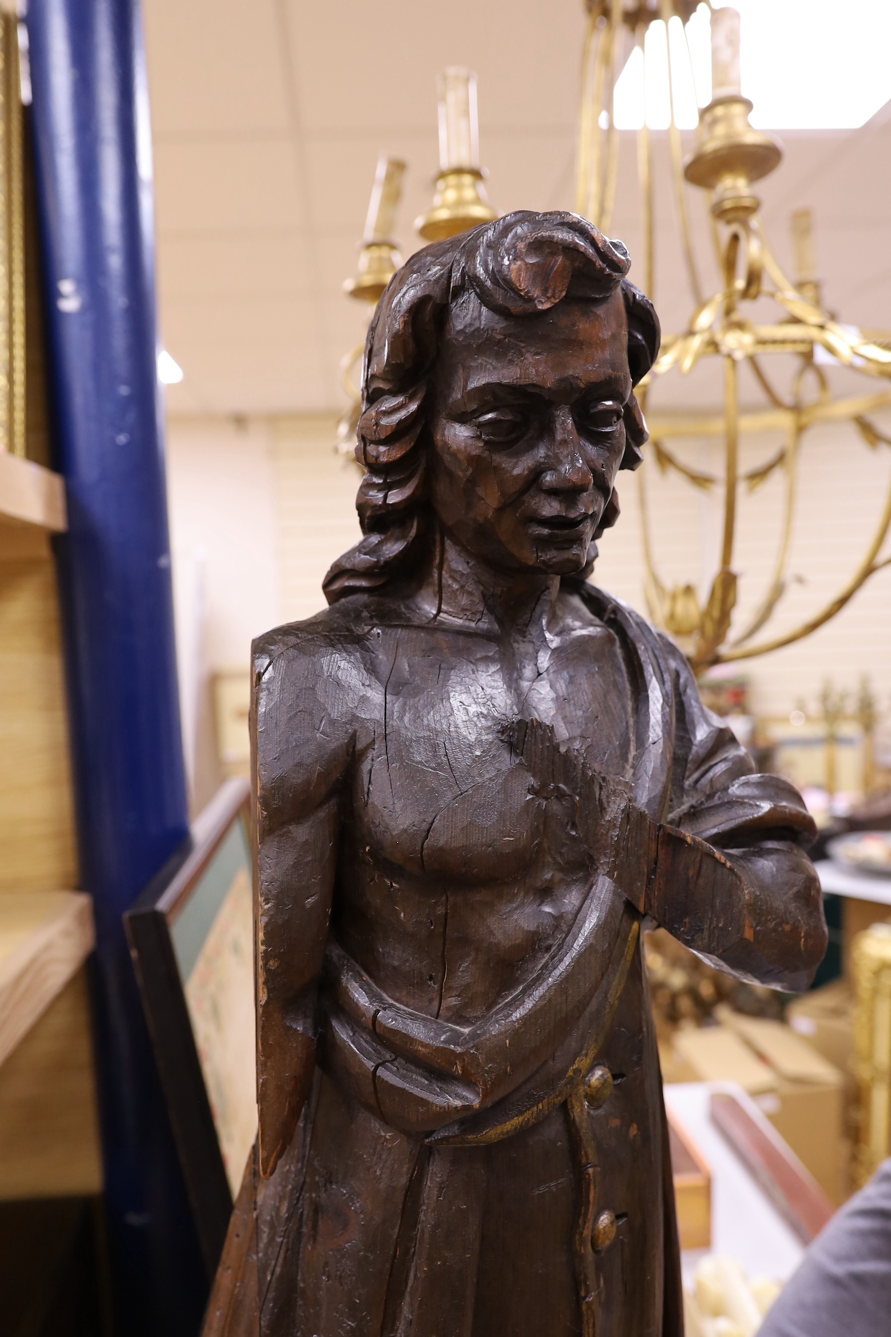 An early 18th century French figurative carving, 84cm high